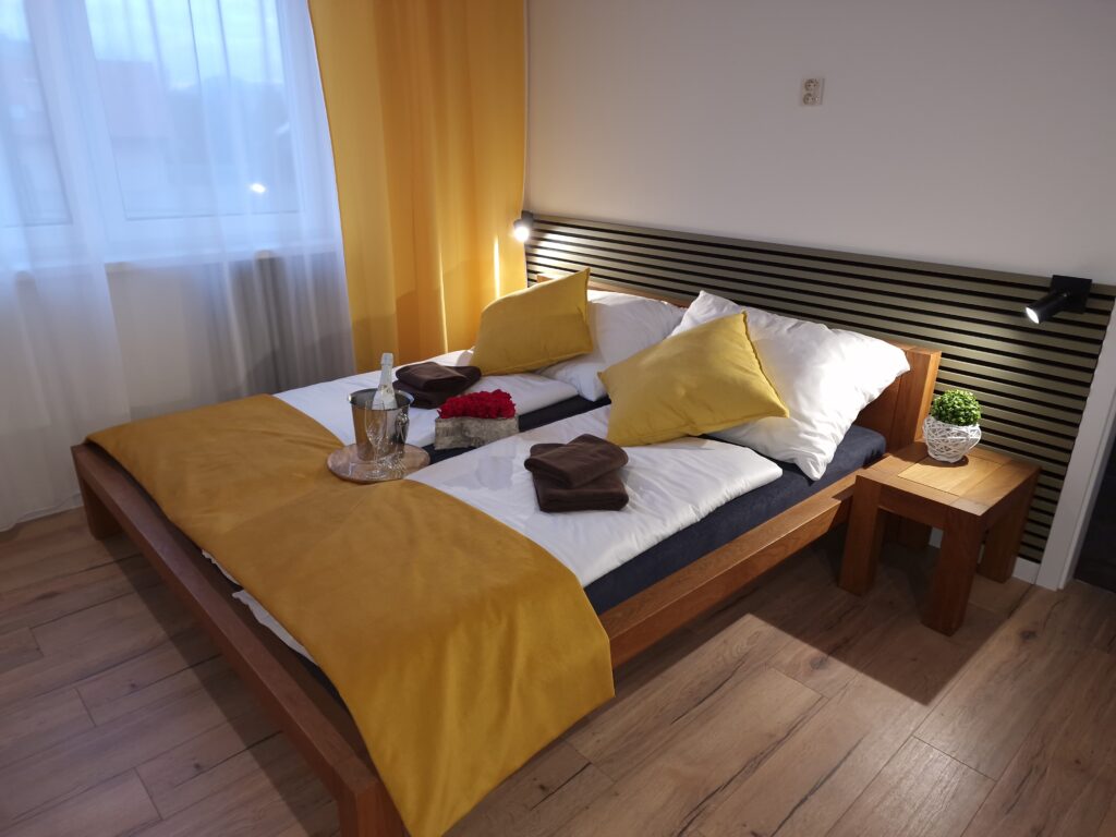 Interior of apartment with double bed and big window
