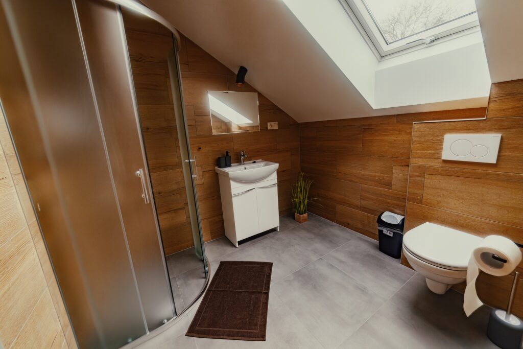 Bathroom with sink, shower and mirror